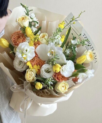 Yellow tone mix tulip orchid bouquet