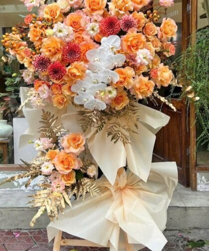 WHITE ORANGE MIX ORCHID OPENING STAND